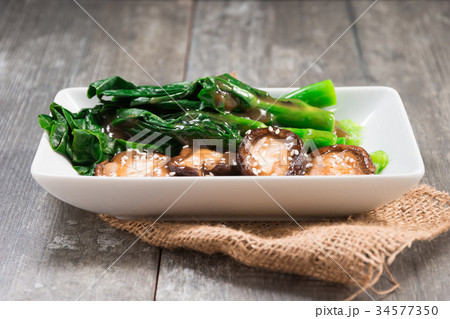 Stir Fried Mushroom and Kale with Sauce 34577350