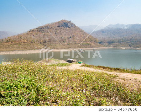 Houseboat and  fishing boat in Thailand lake 34577650
