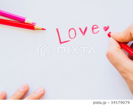 Color pencils on white paper with love and red hea Color pencils on white paper with love and red hea 34579079