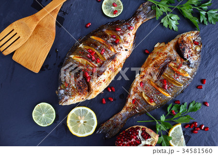 roasted Gilthead seabream fish oin stone roasted Gilthead seabream fish oin stone 34581560