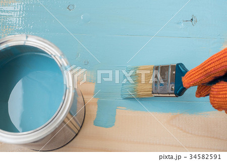 worker paints board worker paints board 34582591