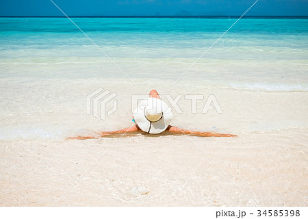woman in straw hat resting tropical Thailand beach woman in straw hat resting tropical Thailand beach 34585398
