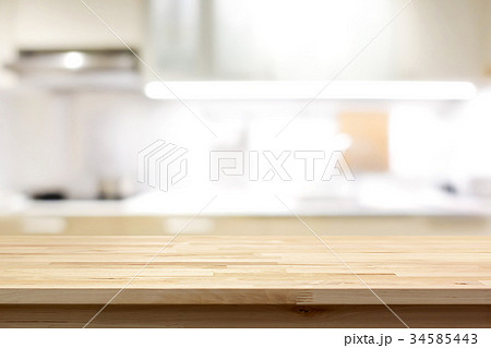 Wood table top on blur kitchen interior background 34585443