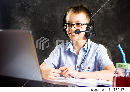 Boy having a video call with headset 34585474