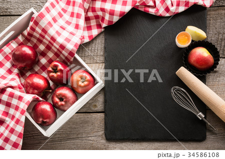 Ripe red apples in birch-box on wooden board. Ripe red apples in birch-box on wooden board. 34586108