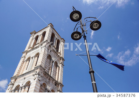 historic medieval tower church With lamppost and 34587376