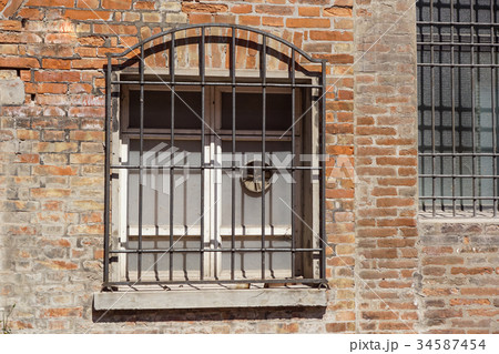 grunge wooden window on brick wall. grunge wooden window on brick wall. 34587454