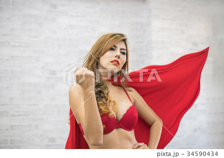Super sexy girl in sexy red dress showing The strong. 34590434