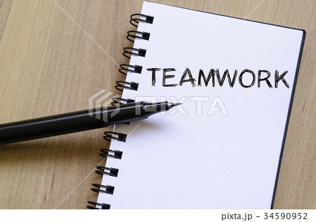 Teamwork write on notebook Teamwork write on notebook 34590952