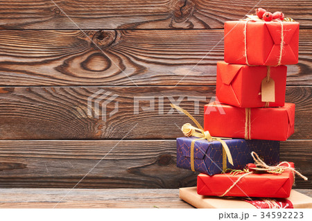 Christmas presents on wooden background 34592223