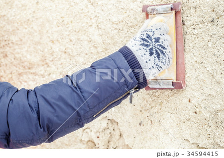 Builder working with grinding tool Builder working with grinding tool 34594415