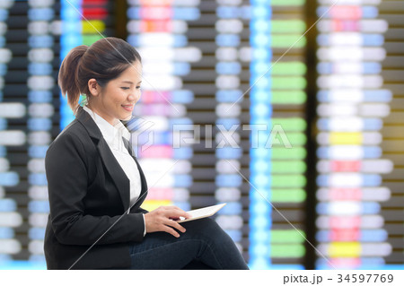 business traveler waiting with airport background business traveler waiting with airport background 34597769