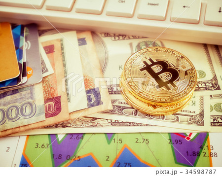 Golden bitcoin with banknote background conceptual 34598787