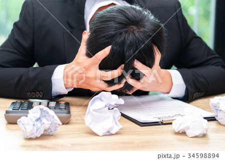 Stressed businessman make mistake with paper Stressed businessman make mistake with paper 34598894