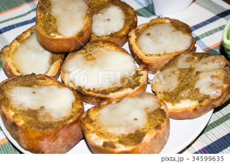 Toasted bread with olive paste and cheese 34599635