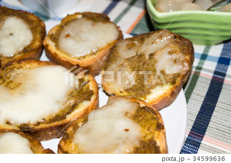 Toasted bread with olive paste and cheese 34599636