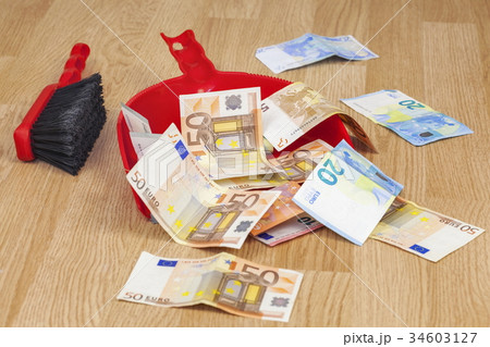 Brush with euros in garbage scoop Brush with euros in garbage scoop 34603127