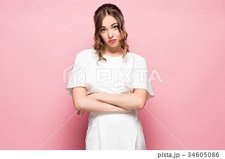 The young woman's portrait with thoughtful The young woman's portrait with thoughtful 34605086