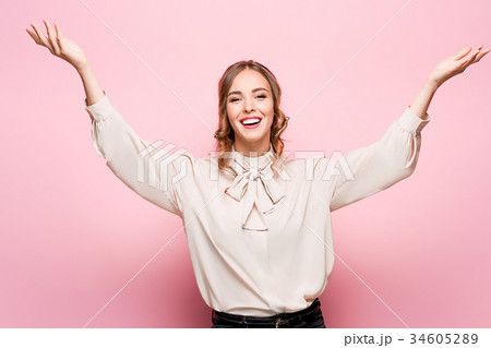 The young woman's portrait with happy emotions The young woman's portrait with happy emotions 34605289