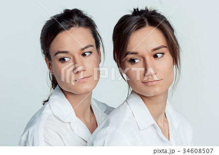 Studio portrait of female twins 34608507