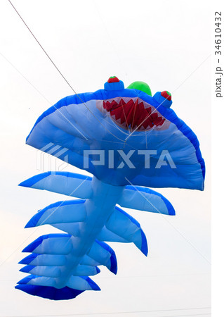 Blue kite that is flying Blue kite that is flying 34610432