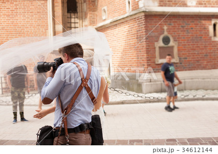 The photographer takes pictures of the bride 34612144