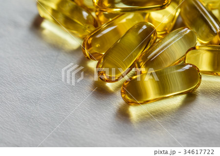 Fish oil supplement, medical and health concept Fish oil supplement, medical and health concept 34617722