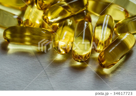 Fish oil supplement, medical and health concept Fish oil supplement, medical and health concept 34617723