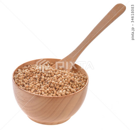Coriander seeds in wooden bowl on white background Coriander seeds in wooden bowl on white background 34618083