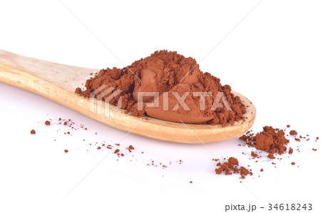 Cocoa powder in a spoon on a white background Cocoa powder in a spoon on a white background 34618243