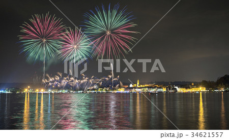 Fireworks on the lake in a summer night Fireworks on the lake in a summer night 34621557