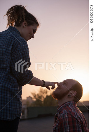 Happy couple in love on sunset backdrop closeup 34630678