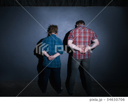 Arrested criminal couple. Partners in crime Arrested criminal couple. Partners in crime 34630706