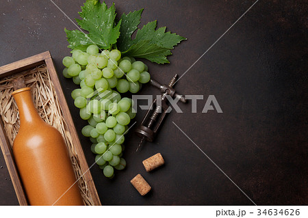 Wine bottle and grapes 34634626