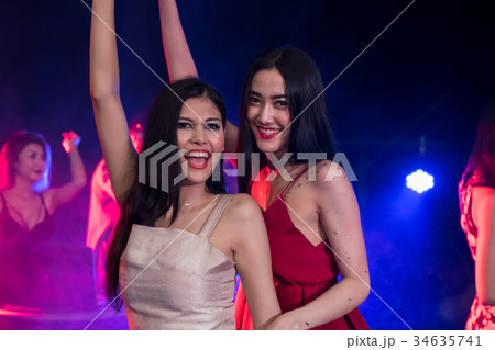 Young people are celebrating the night party entertainment. 34635741