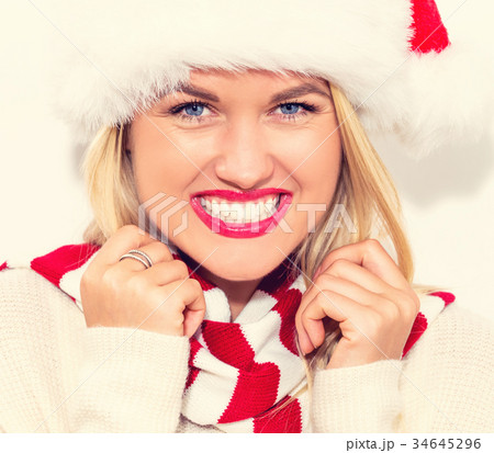 Happy young woman with Santa hat 34645296