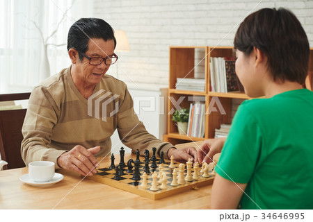 Enjoying chess game Enjoying chess game 34646995