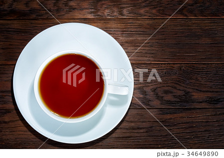 Cup of tea on a wooden background top view. 34649890