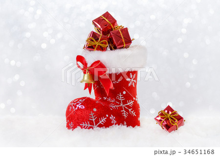 christmas stocking with gifts, santa's boot in 34651168