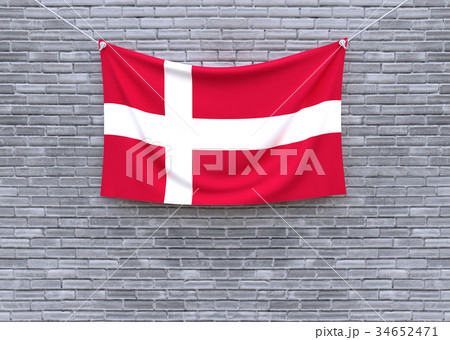 Denmark flag hanging on brick wall.  34652471