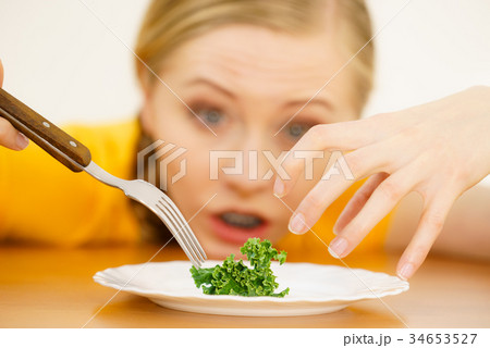Shocked young woman being on diet Shocked young woman being on diet 34653527