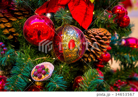 Christmas decorations on the branches of fir tree 34653567