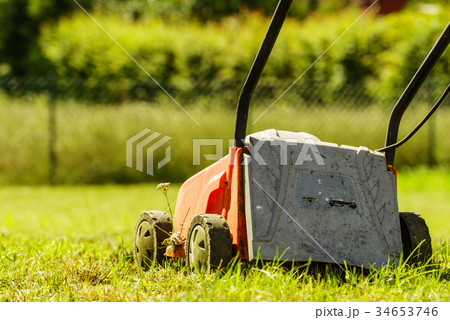 Gardening. Mowing lawn with lawnmower Gardening. Mowing lawn with lawnmower 34653746