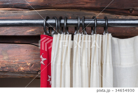 Close up of a curtain rail and hanging curtain and Close up of a curtain rail and hanging curtain and 34654930