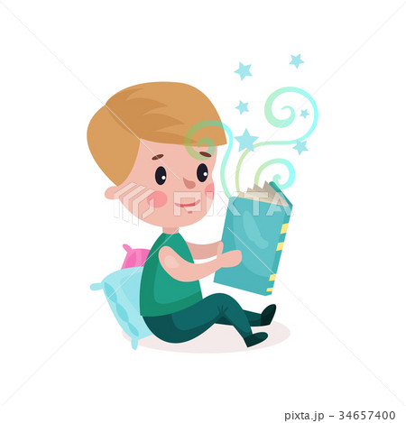 Cute little boy sitting on the floor and reading 34657400