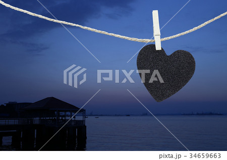 Black Heart hung on hemp rope. 34659663