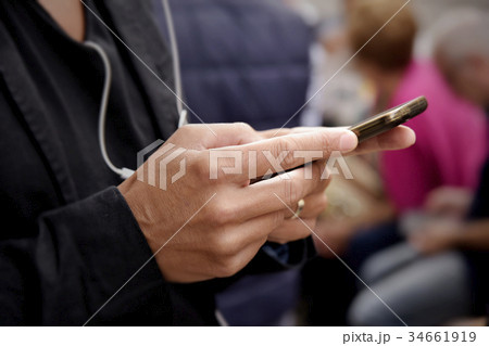 young man using his smartphone young man using his smartphone 34661919