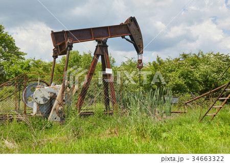 Oil well on a landscape Oil well on a landscape 34663322