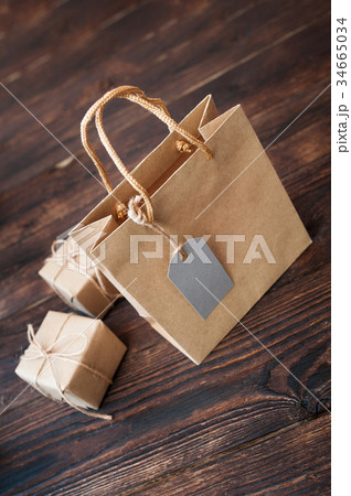 Mockup Paper bag from kraft paper with gift tag 34665034