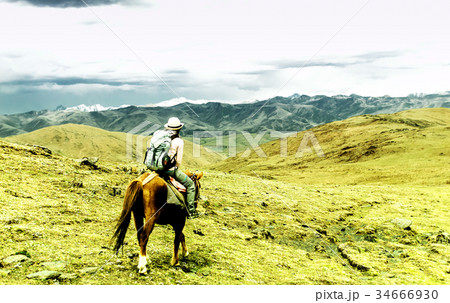 Horse trekking in tibetan highlands of China Horse trekking in tibetan highlands of China 34666930